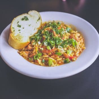 bowl of orzo pasta with vegetables