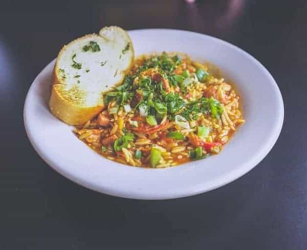 bowl of orzo pasta with vegetables