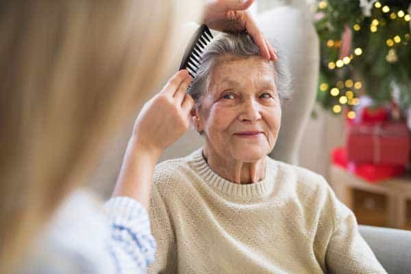 carer providing palliative care at home