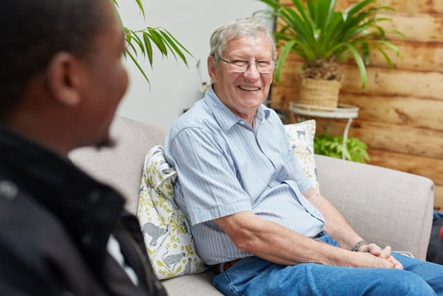 senior man laughing with a friend
