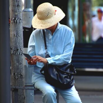 woman face-timing her elderly mother